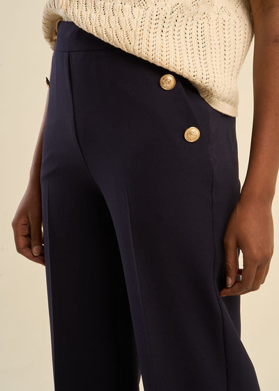 Pantalon effet pont à boutons dorés