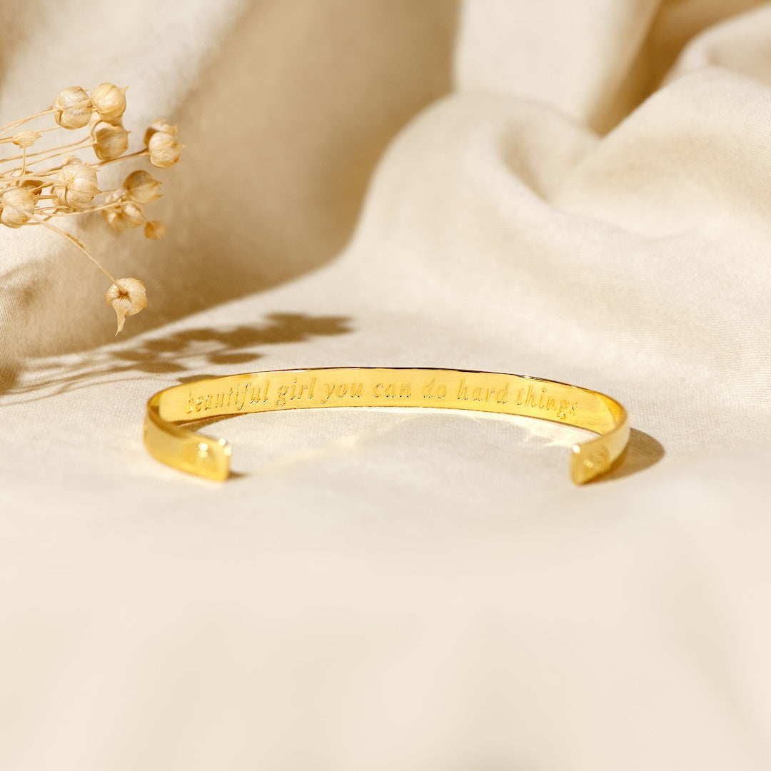 Edmonton Essence™ | Engraved Cuff Bracelet  
A motivational accessory for strength.