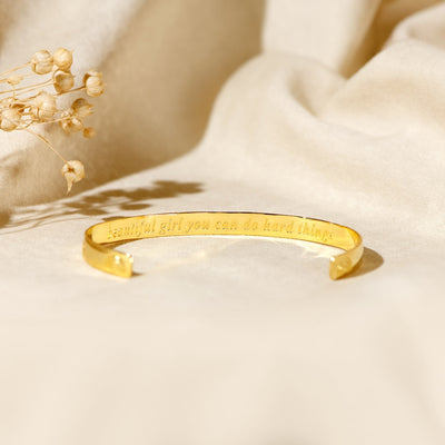 Edmonton Essence™ | Engraved Cuff Bracelet  
A motivational accessory for strength.