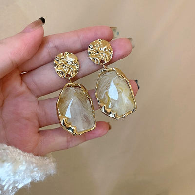 Boucles d’oreilles faites main avec une grande pierre de lune