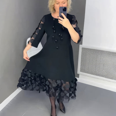 Robe longue fluide avec embellissements élégants
