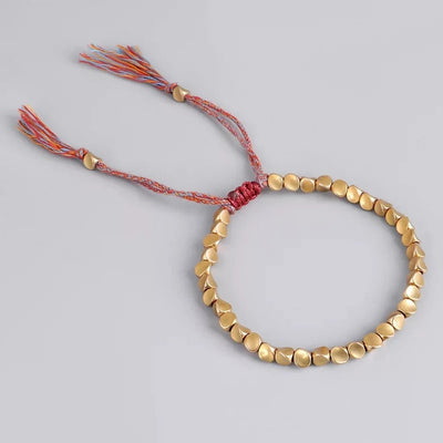 Bracelet tibétain porte-bonheur en cuivre – Énergie et prospérité